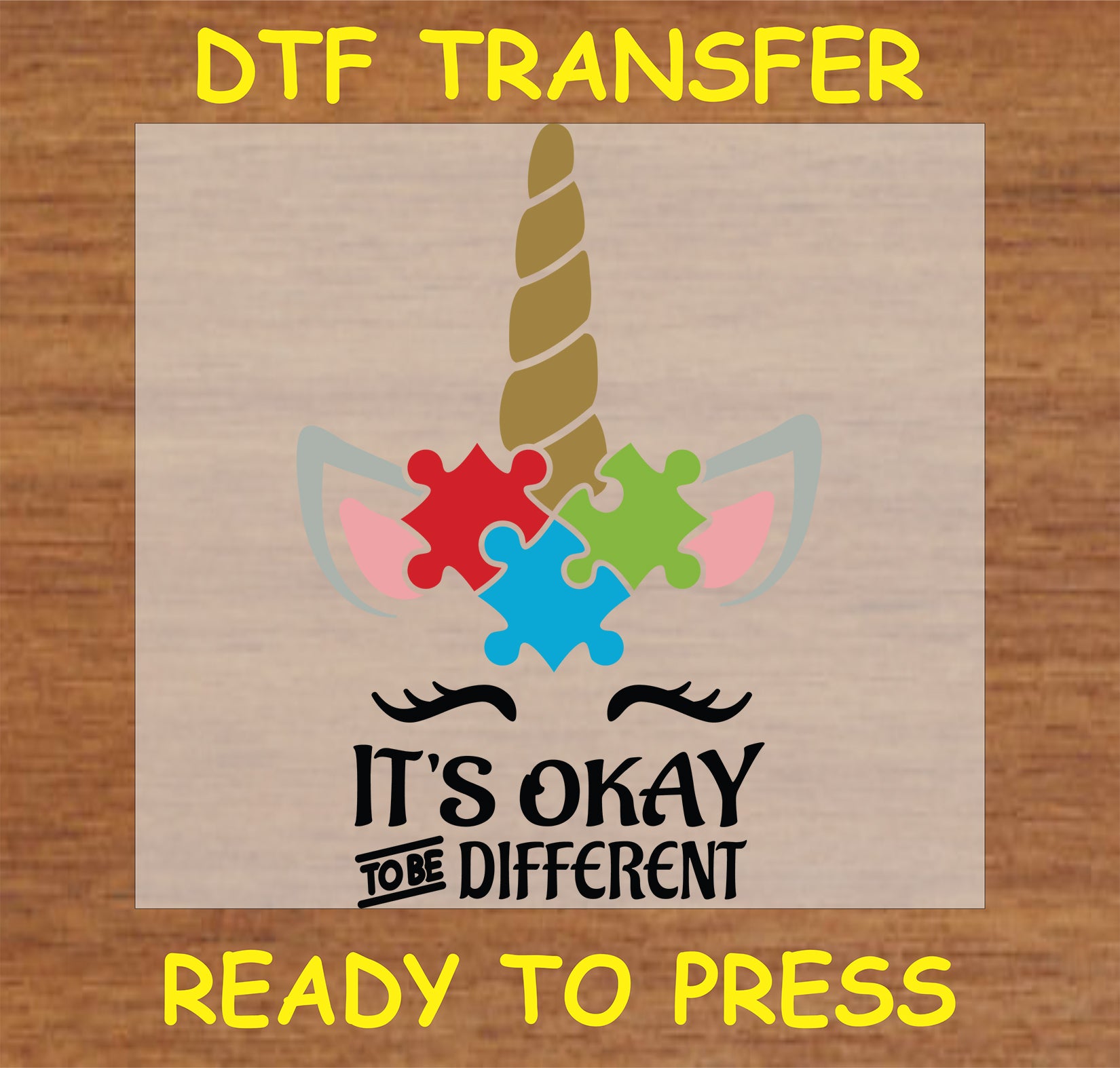 "It's Okay to Be Different DTF Transfer featuring a unicorn and colorful puzzle pieces design"