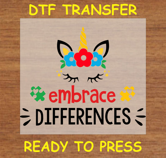 "Embrace Differences unicorn DTF transfer with autism puzzle pieces and positive message"