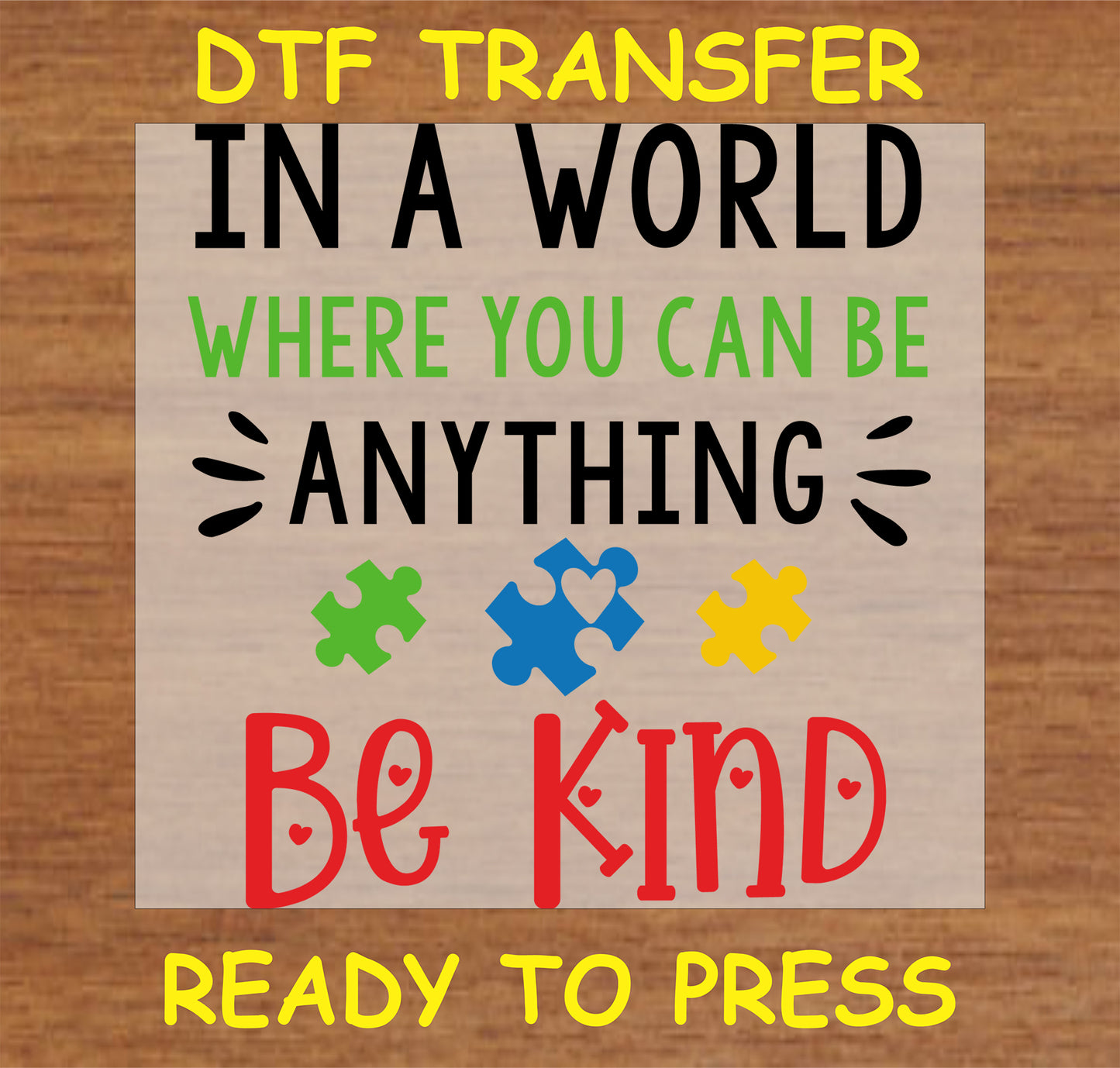 "In a World Where You Can Be Anything, Be Kind DTF transfer with puzzle heart design"