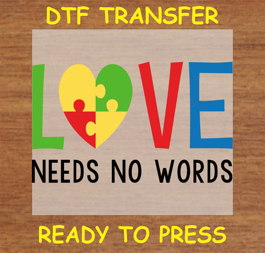 "Love Needs No Words DTF transfer with colorful heart puzzle piece design for autism awareness"