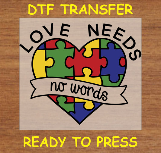 "Love Needs No Words DTF transfer with colorful heart puzzle design and banner for autism awareness"