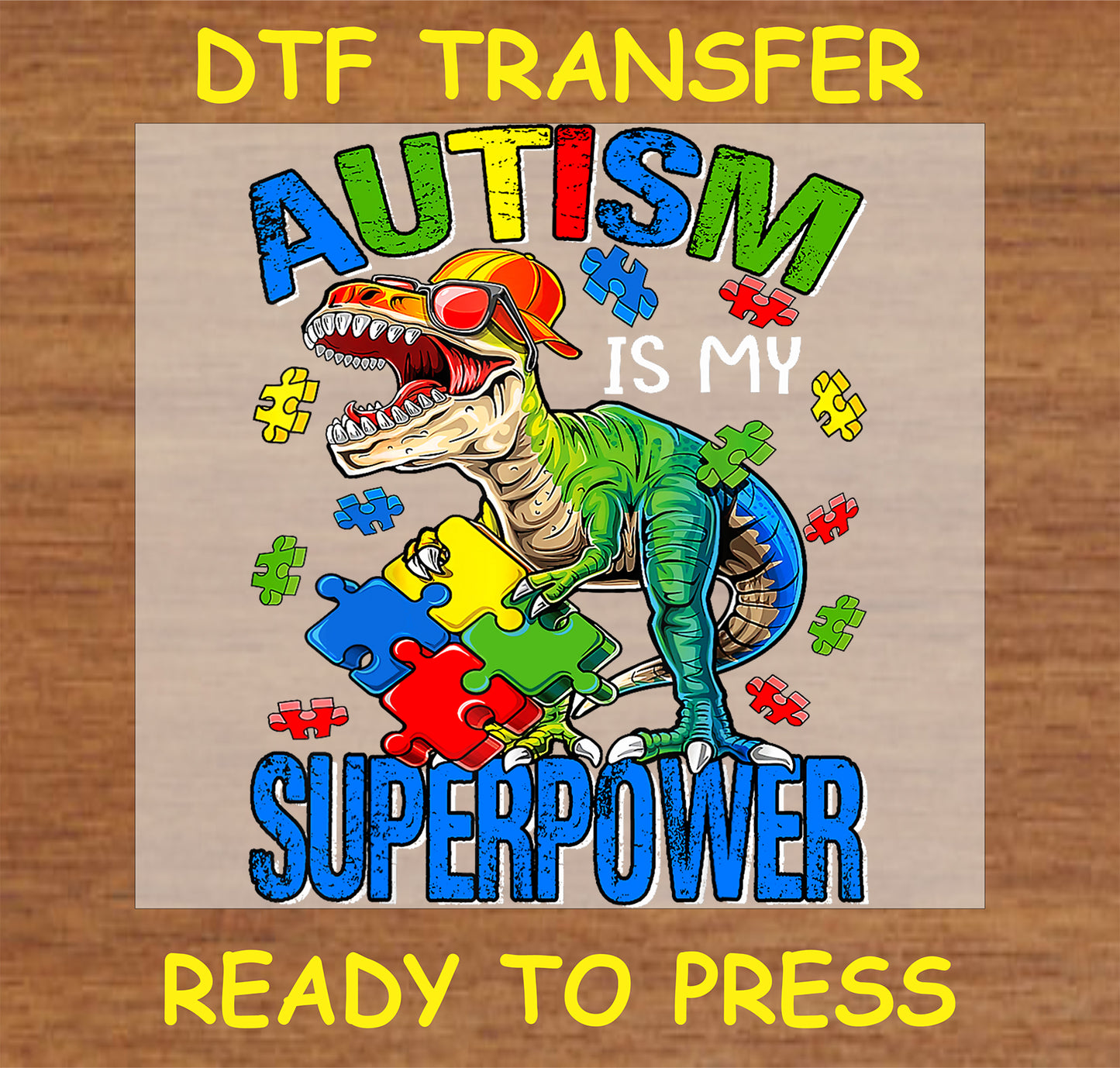 "Autism is My Superpower DTF Transfer with dinosaur and colorful puzzle pieces for autism awareness"