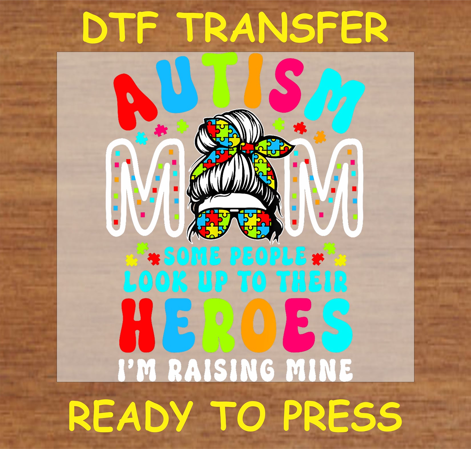 "Autism Mom DTF Transfer with puzzle design and text 'Raising My Hero'"