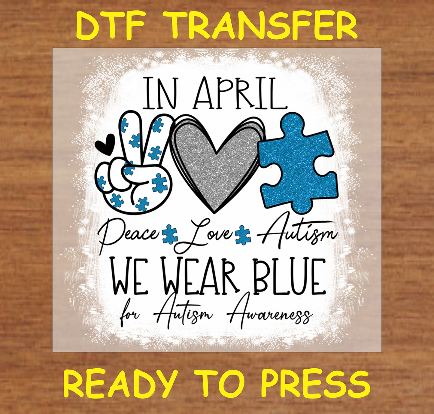 "In April We Wear Blue DTF Transfer with glitter heart and puzzle pieces promoting autism awareness"