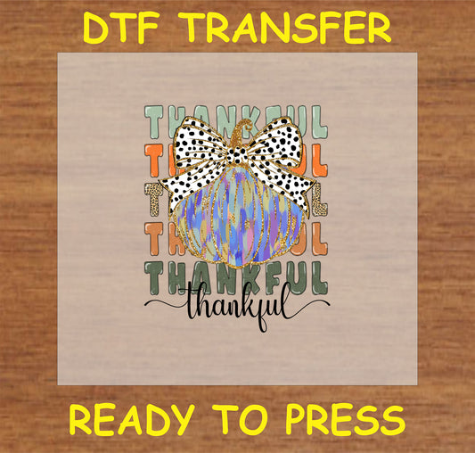 "Thankful Pumpkin DTF Transfer with blue and gold abstract pumpkin, polka dot bow, and 'Thankful' text for Thanksgiving and fall decor"