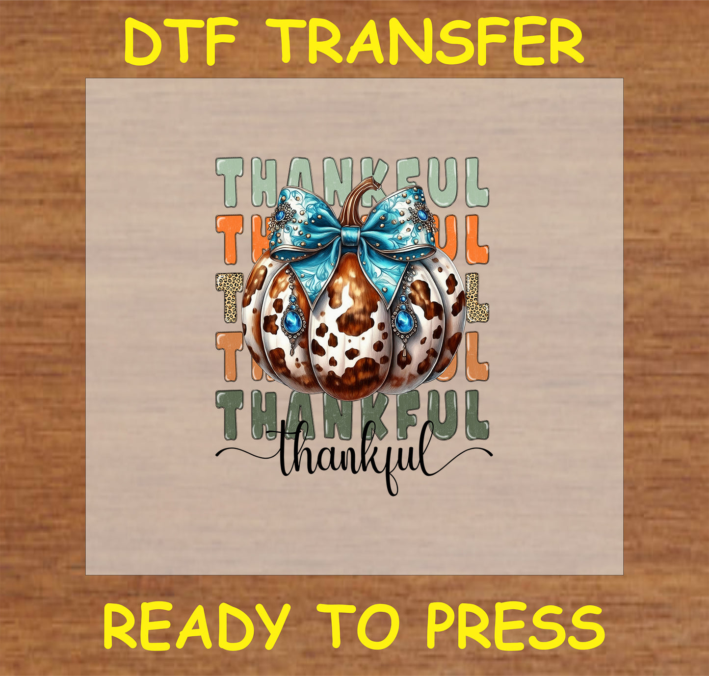 "Thankful DTF Transfer with cow print pumpkin, blue bow with gem accents, and 'Thankful' text for fall decor"