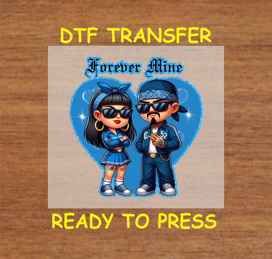 “Forever Mine” ready to press DTF transfer! This cute design features a Chicano couple with a blue heart accent.