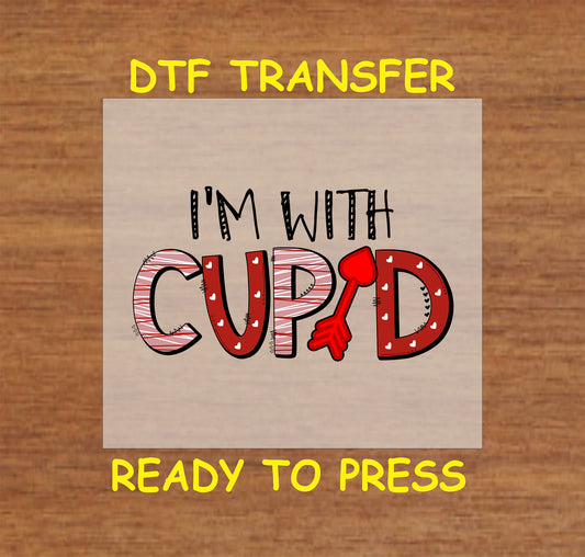 I’m With Cupid DTF Transfer featuring red Cupid arrow and bold Valentine letters – Ready to Press.