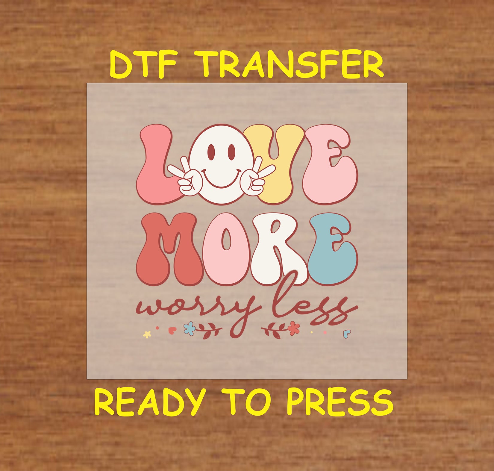 Retro DTF transfer with a smiley face, peace signs, and colorful "Love More, Worry Less" text.