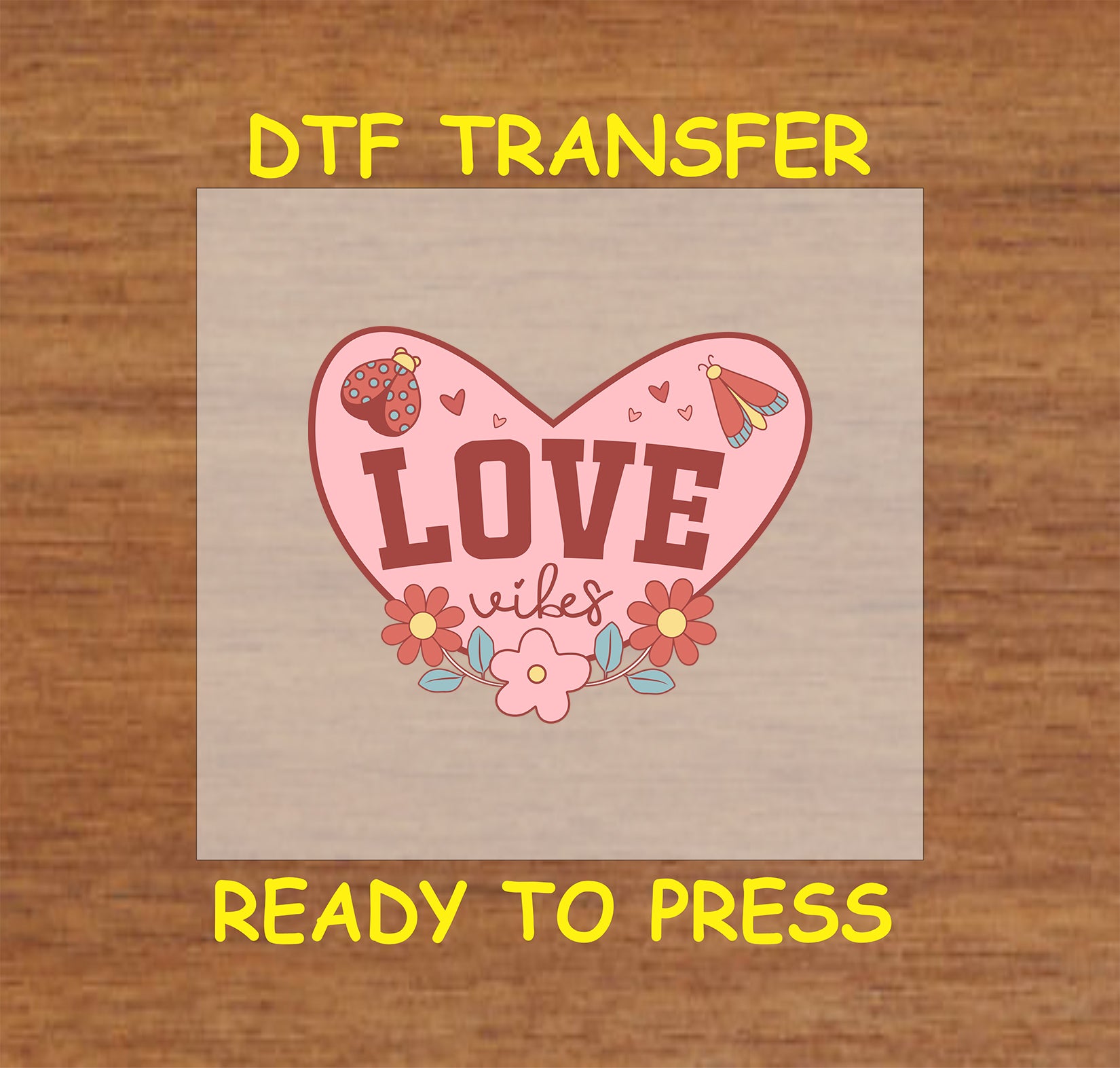 Retro heart-shaped DTF transfer with flowers, ladybugs, and "Love Vibes" text.