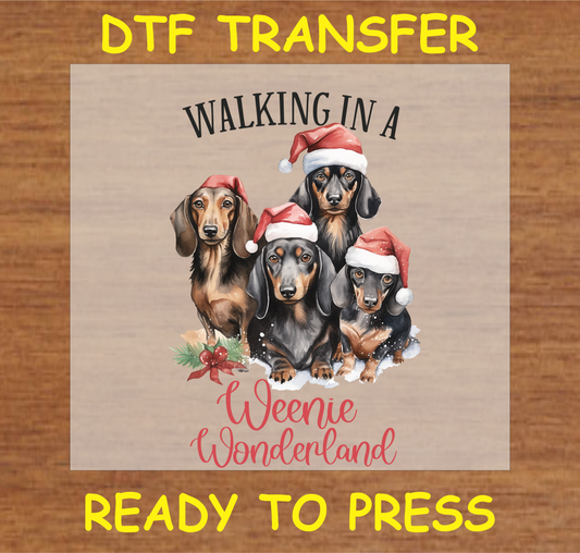 Four dachshunds in Santa hats, "Walking in a Weenie Wonderland" DTF transfer.