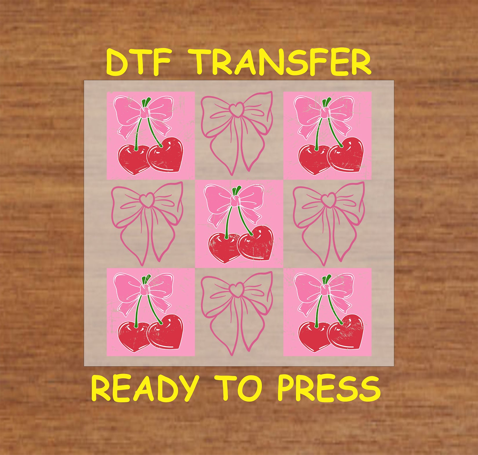 DTF transfer featuring heart-shaped cherries tied with a pink bow on a Valentine's Day-themed pink background.