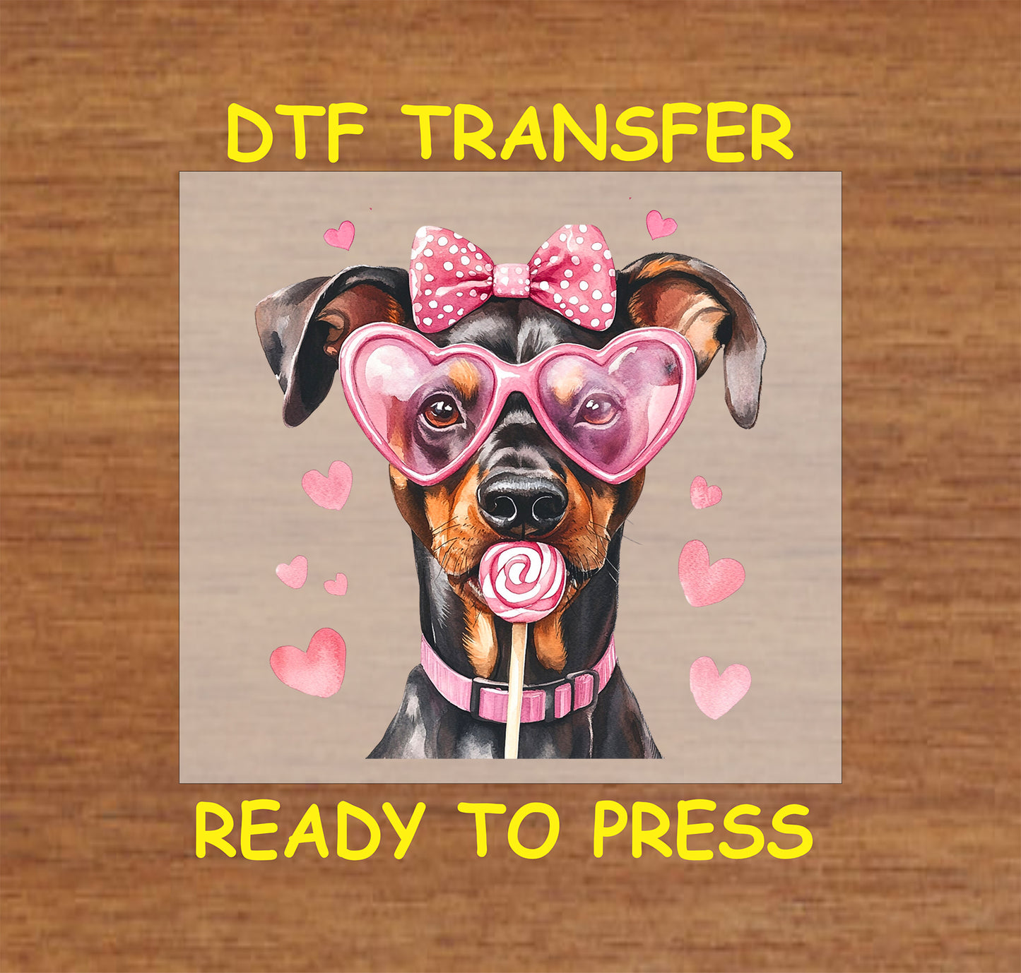 DTF transfer featuring a Doberman with pink heart-shaped glasses, a polka dot bow, and a lollipop surrounded by heart accents.