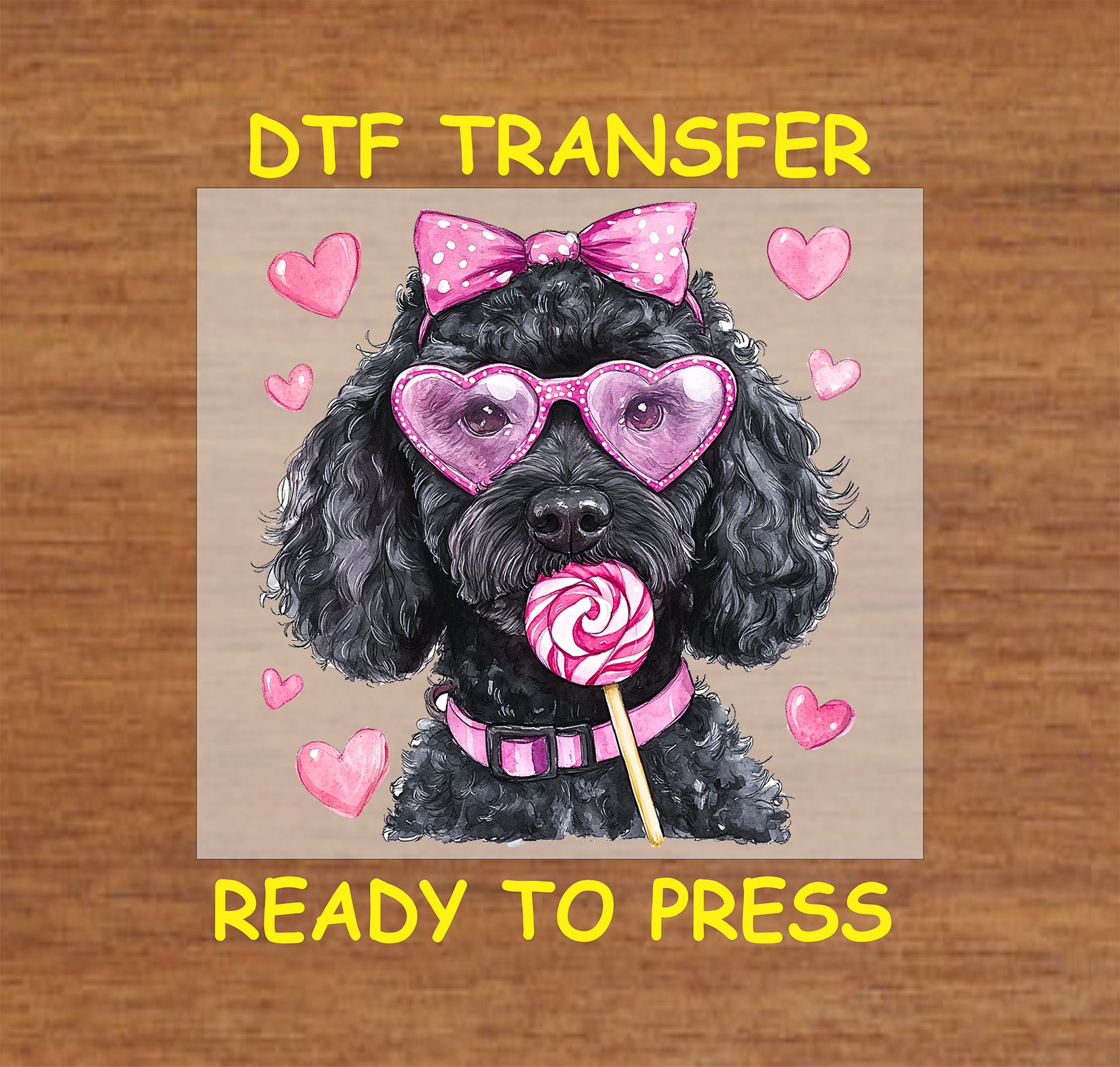 DTF transfer design featuring a black doodle dog wearing pink heart-shaped glasses, a polka-dot bow, and holding a lollipop, surrounded by pink hearts for Valentine's Day.