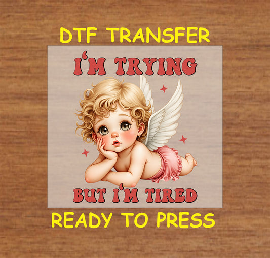 "I'm Trying But I'm Tired" DTF Transfer featuring a cute, tired angel with wings and a playful Valentine theme, perfect for t-shirts and sweatshirts.