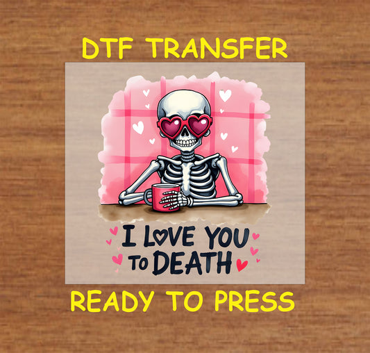 "I Love You to Death" DTF transfer featuring a skeleton with heart sunglasses, a coffee mug, and pink romantic elements for Valentine’s Day.