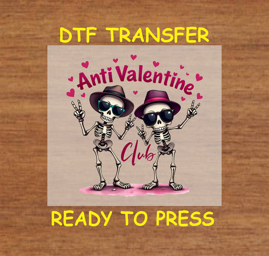 Anti-Valentine's Day-themed DTF transfer with two skeletons in hats and sunglasses, surrounded by hearts and the text "Anti Valentine Club."