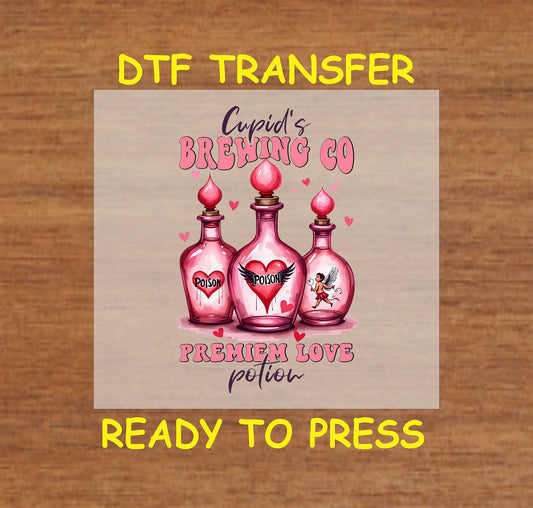 Cupid's Brewing Co DTF Transfer featuring pink potion bottles labeled "Poison" and "Premium Love Potion" with heart and Cupid accents, perfect for Valentine’s Day.