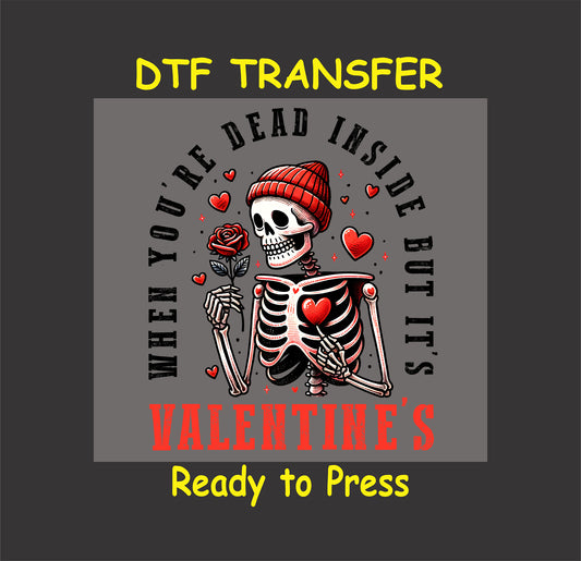 Skeleton wearing a red beanie, holding a rose with the text "When You're Dead Inside But It's Valentine's," surrounded by hearts.