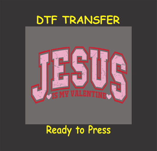 Inspirational Valentine’s Day design featuring bold pink varsity-style "JESUS" text with red and heart accents on a gray background.