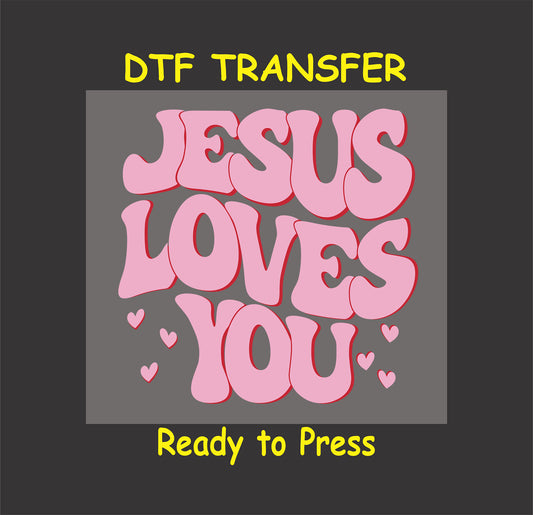 Groovy pink bubble-style text reading "Jesus Loves You" with red outlines and small heart accents, ready for heat transfer on clothing.