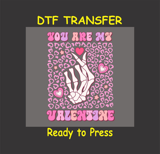 "You Are My Valentine" DTF transfer featuring a skeleton hand forming a heart with a pink leopard print background and ready-to-press format.