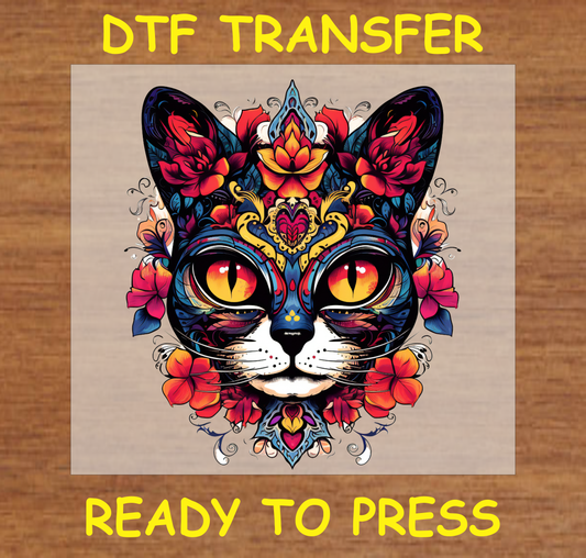 Día de los Muertos DTF transfer featuring a cat face with bright yellow eyes and intricate floral patterns.