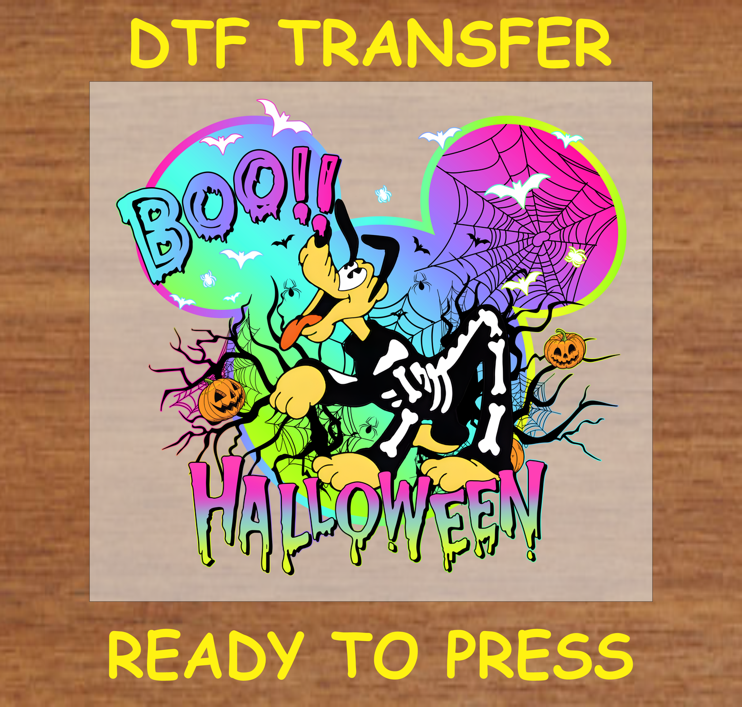 Skeleton character surrounded by Halloween elements, including pumpkins, spider webs, and 'BOO!' text in colorful DTF transfer.