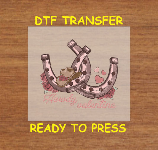 Western Valentine DTF transfer with "Howdy Valentine" text, horseshoes, cowboy hat, and roses.