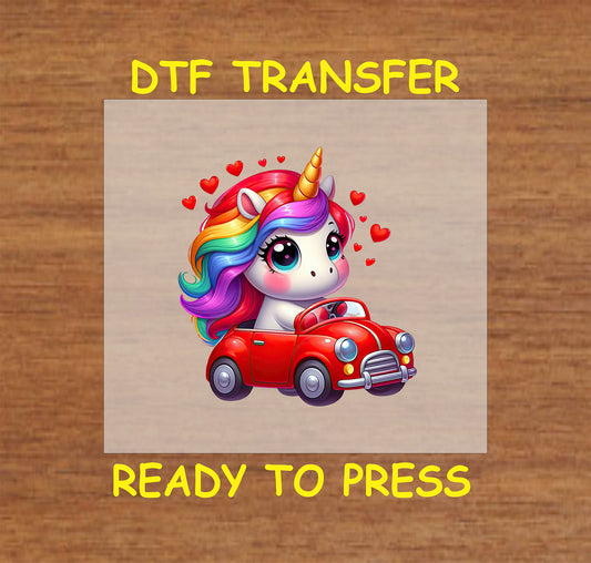 Cute unicorn with rainbow hair sitting in a red car with hearts DTF transfer.