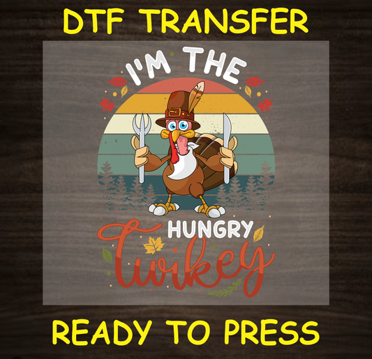 Thanksgiving DTF transfer featuring a funny turkey with utensils and the text "I'm the Hungry Twinkey."