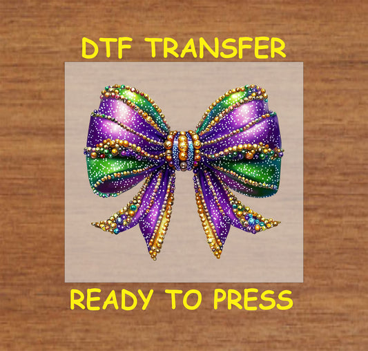 Mardi Gras bow with sparkling beads in purple, green, and gold.