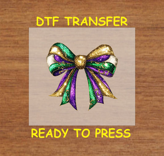 Mardi Gras glitter bow in purple, green, and gold with sparkling details.