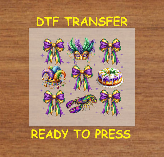 Mardi Gras DTF transfer featuring bows, a mask, a jester hat, king cake, and a crawfish in purple, gold, and green.