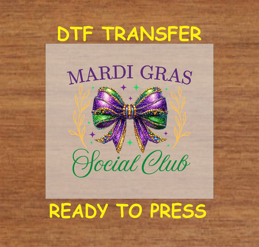 Mardi Gras Social Club DTF transfer with a glittery purple, green, and gold bow and decorative gold accents.