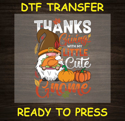 Thanksgiving DTF transfer with a cute gnome holding a turkey, surrounded by pumpkins and fall leaves, with the text "Thanksgiving with My Little Cute Gnome."