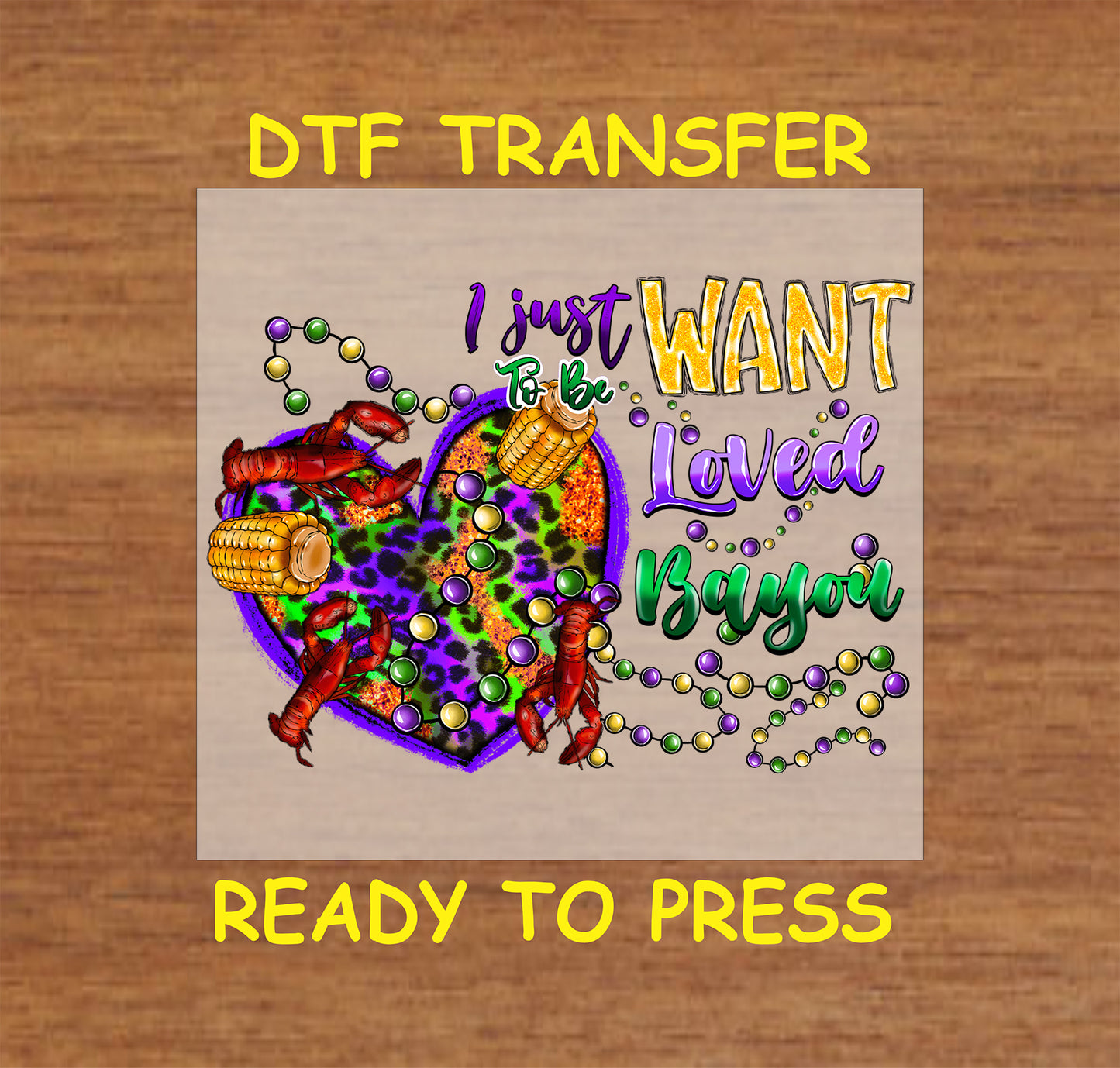 Mardi Gras DTF transfer with "I Just Want to Be Loved Bayou" text, leopard print heart, crawfish, corn, and festive beads.