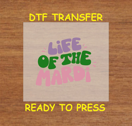 DTF transfer with "Life of the Mardi" text in bold, festive colors.