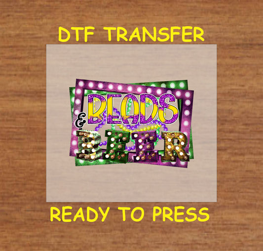 Mardi Gras DTF transfer with "Beads & Beer" text, beads, and marquee lights.