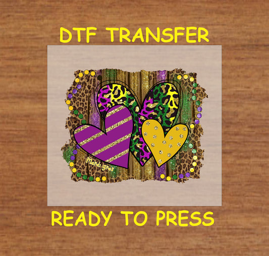 Mardi Gras DTF transfer with colorful hearts, leopard print, and glitter accents.