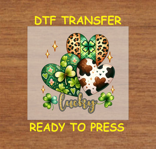 St. Patrick’s Day DTF transfer with patterned hearts, shamrocks, and sparkling accents.