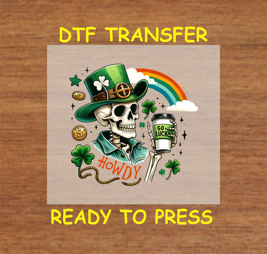 St. Patrick’s Day DTF transfer featuring a skeleton in a green hat, shamrocks, coins, and a rainbow.