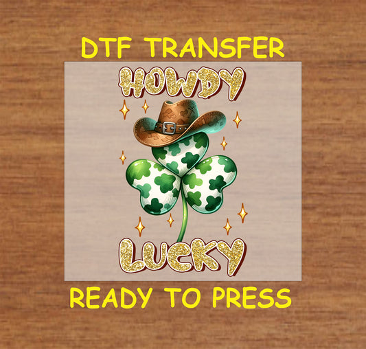 St. Patrick’s Day DTF transfer with a shamrock, cowboy hat, and sparkling "Howdy Lucky" text.