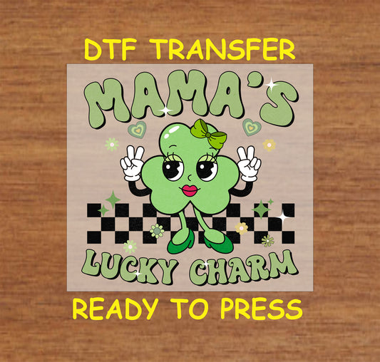 This “Mama’s Lucky Charm” DTF transfer features a cheerful shamrock character with a bow, perfect for a festive St. Patrick’s Day look.