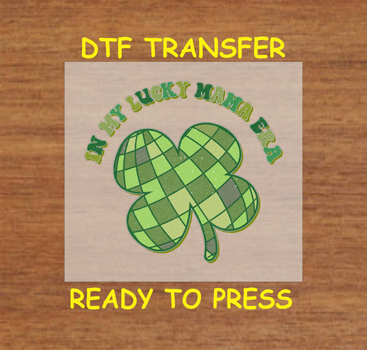 In My Lucky Mama Era DTF transfer with a plaid shamrock and curved text.