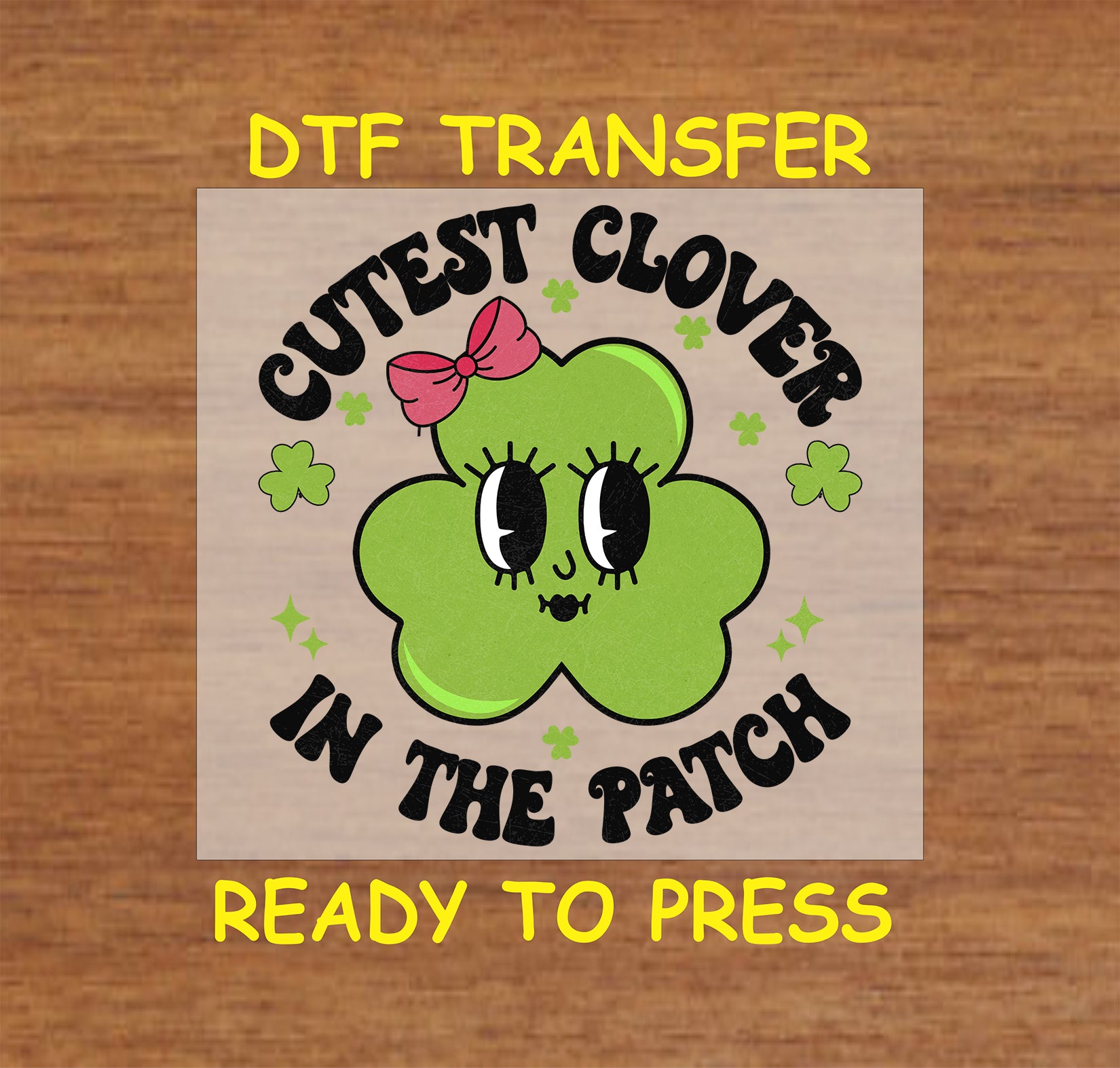 St. Patrick’s DTF transfer with a cute green clover character wearing a pink bow, surrounded by text that reads “Cutest Clover in the Patch.”