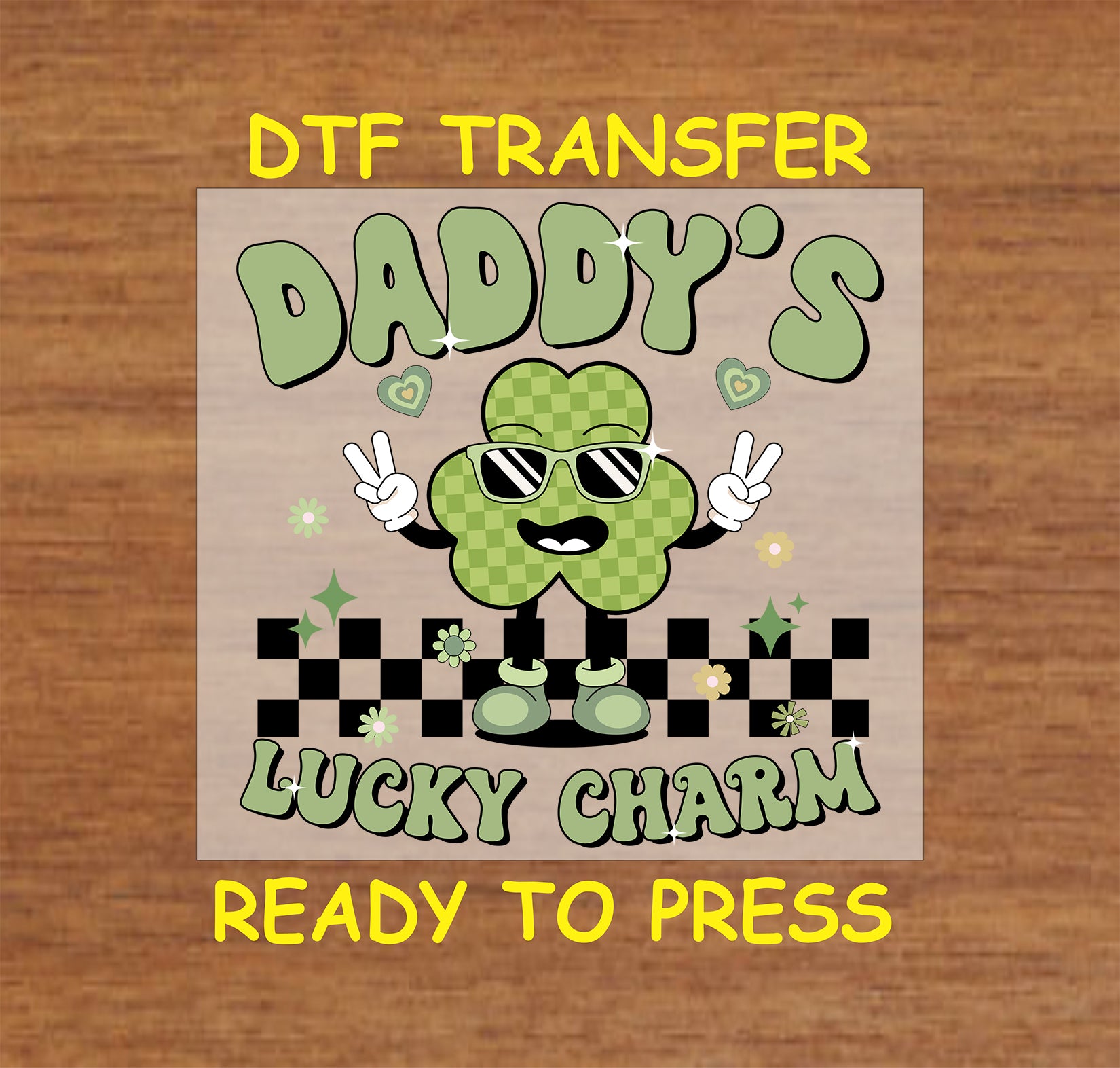 St. Patrick’s DTF transfer with a smiling green shamrock wearing sunglasses and text that reads “Daddy’s Lucky Charm.”