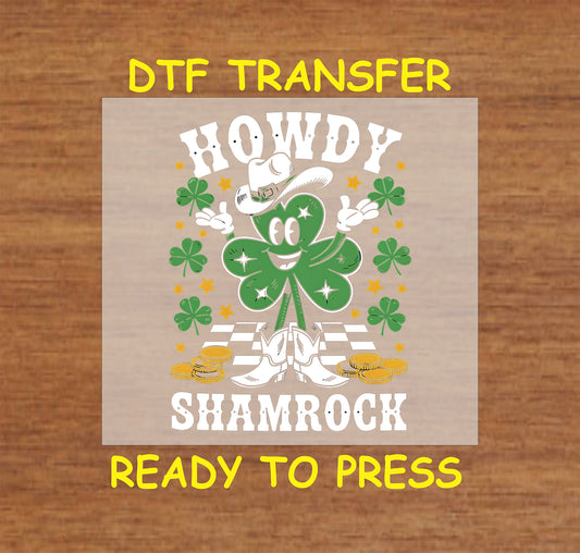 Cartoon shamrock wearing cowboy boots and hat with "Howdy Shamrock" text.