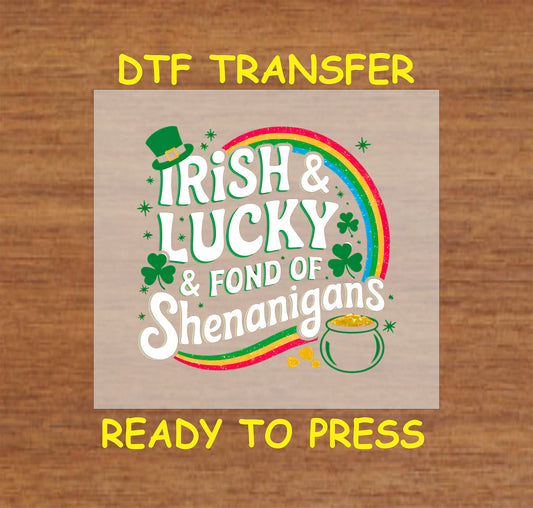 Irish & Lucky St. Patrick’s Day DTF transfer with rainbow, shamrocks, leprechaun hat, and pot of gold.