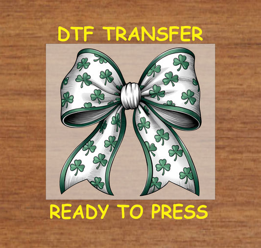 White and green shamrock bow DTF transfer with detailed ribbon design.